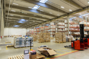 THE LOADING DOCK WAREHOUSE OR SHIPPING LOGISTICS WORKERS UTILIZE A COOLING NECKWEAR COOLER TO STAY ATTENTIVE AND COOL.